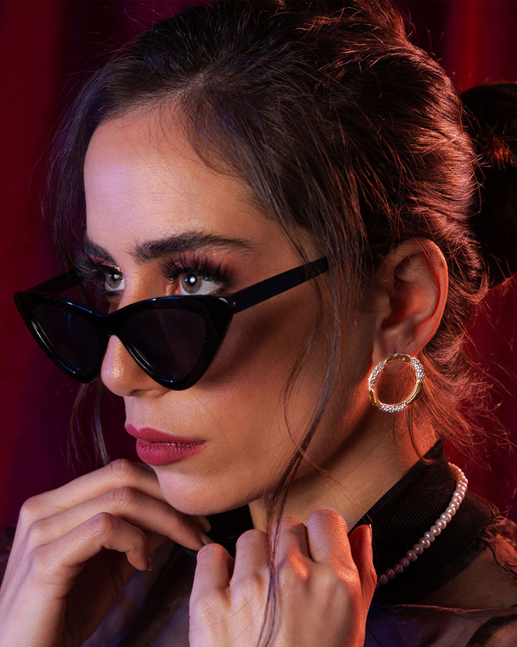 Amusement hoop earrings featuring an alternating pattern of smooth gold and hammered silver-tone segments.