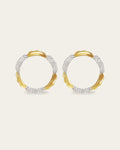 Amusement hoop earrings featuring an alternating pattern of smooth gold and hammered silver-tone segments.