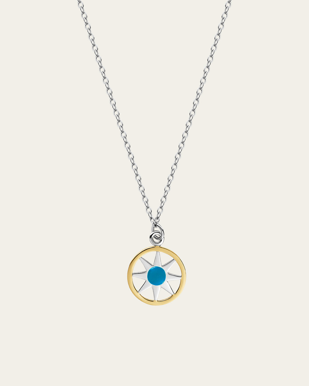 Ancient Sun pendant necklace in gold with a sunburst motif and a delicate adjustable chain.