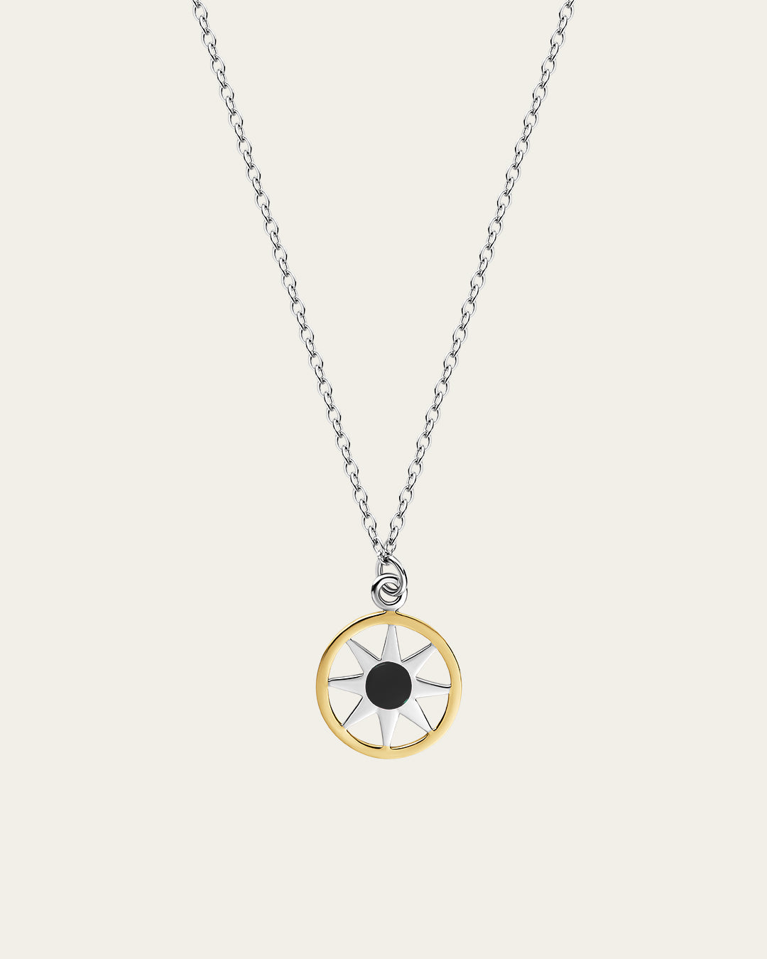Ancient Sun pendant necklace in sterling silver and 18k gold plating with a sunburst motif and a delicate adjustable chain.