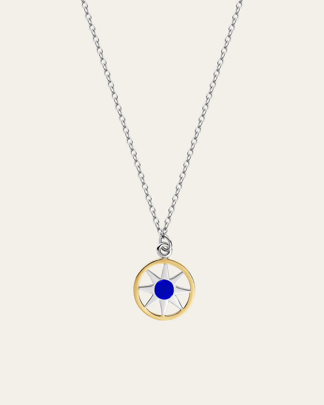 Ancient Sun pendant necklace in sterling silver and 18k gold plating with a sunburst motif and a delicate adjustable chain.