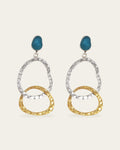 Two-tone Attachment drop earrings with textured silver and gold oval links hanging from a teal blue stone