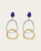 Two-tone Attachment drop earrings with textured silver and gold oval links hanging from a  blue stone