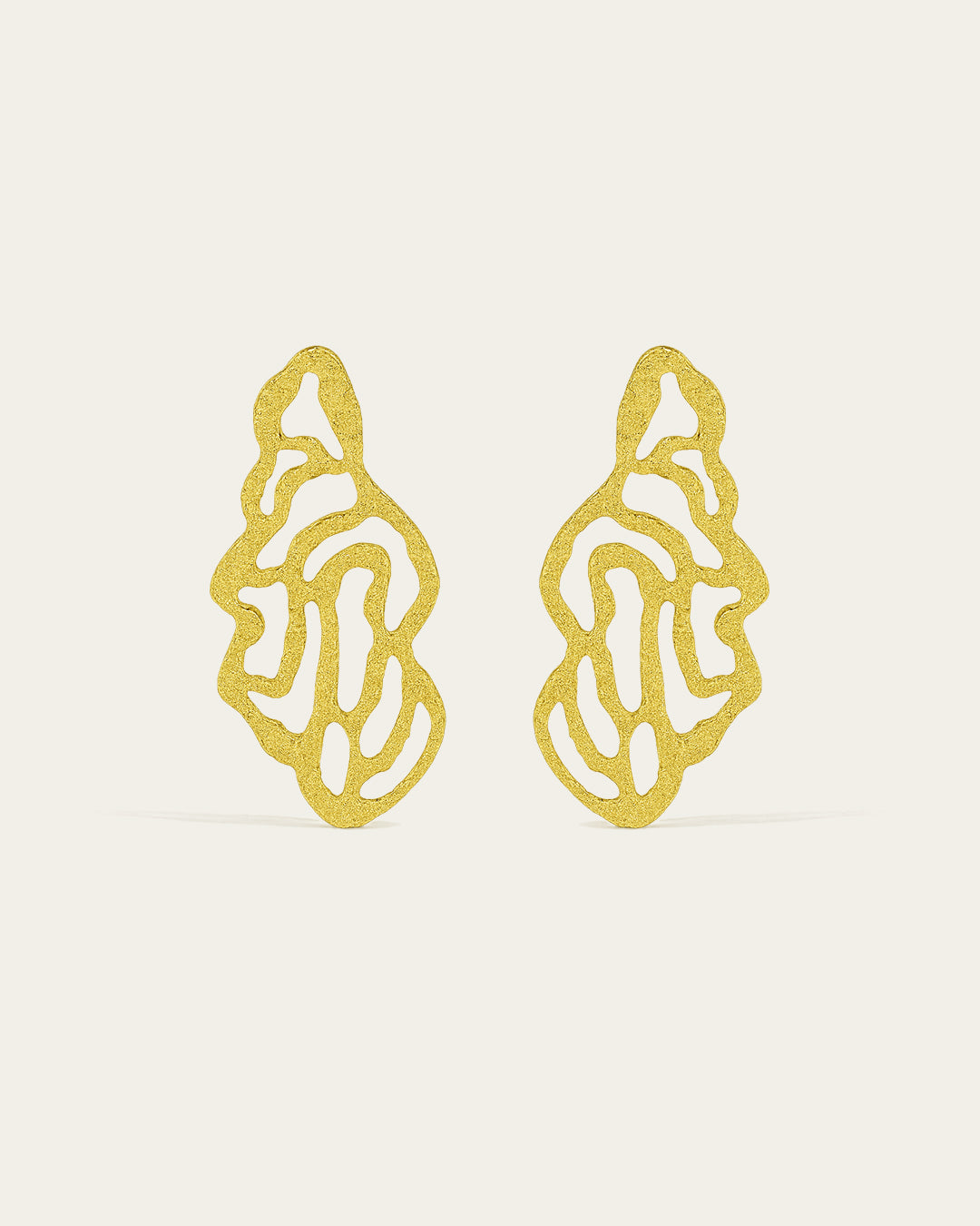 Coral earrings by Ann Elsaban Jewelry in 18K gold-plate, organic coral-inspired sculptural earrings with fluid forms and a polished finish, worn as an elegant statement piece