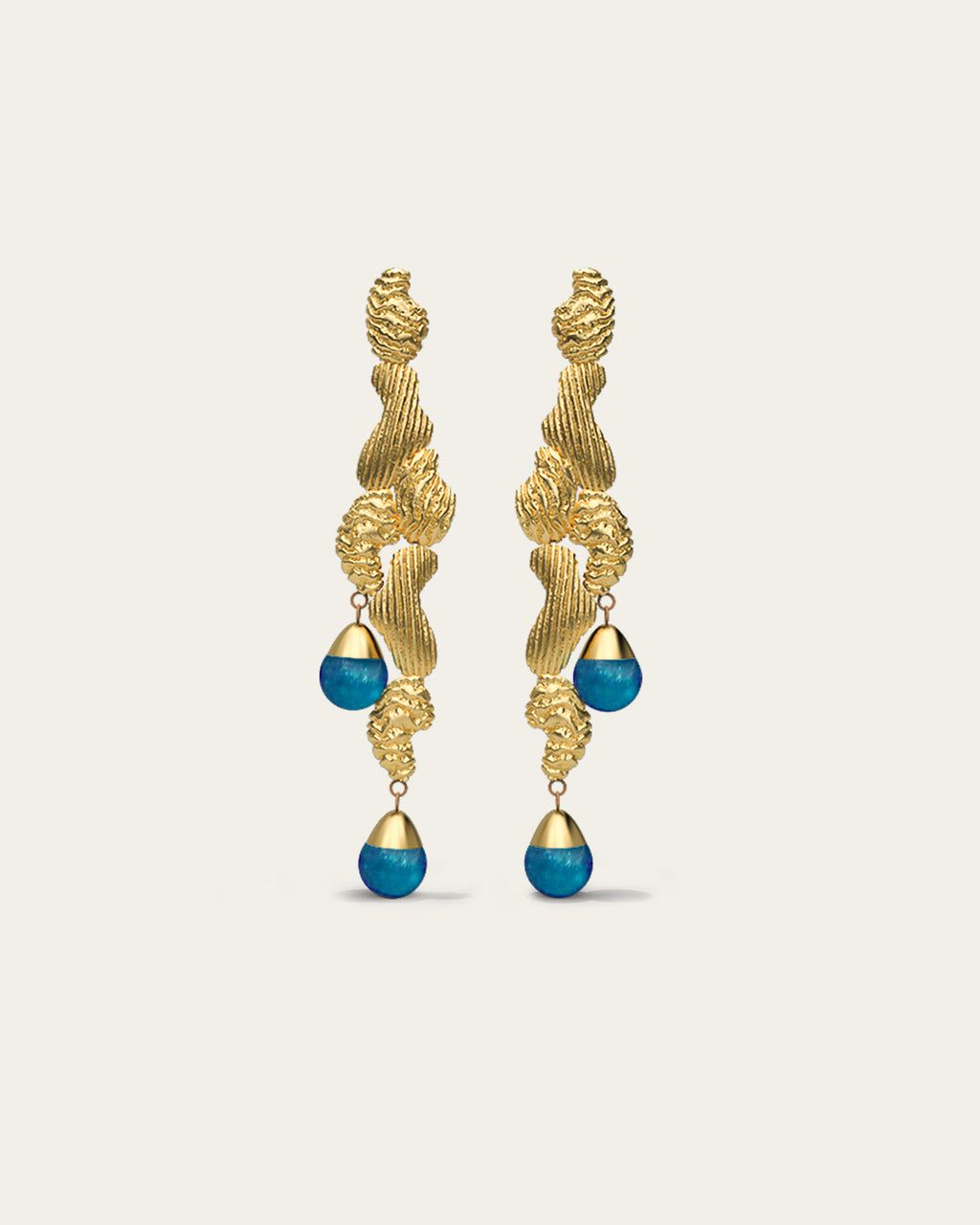 Handcrafted Fluva earrings in 18k gold plated silver with a bold, sculptural shape inspired by flowing water.