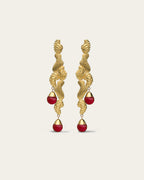 Handcrafted Fluva earrings in 18k gold plated silver with a bold, sculptural shape inspired by flowing water.
