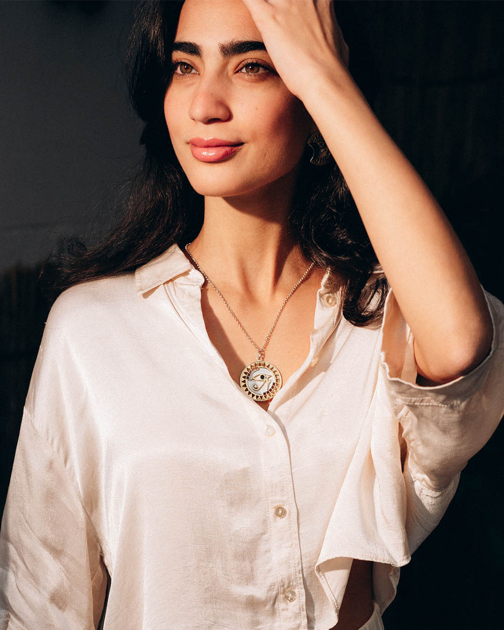 Sterling silver Eye of Horus necklace with protective symbolism and textured geometric accents.