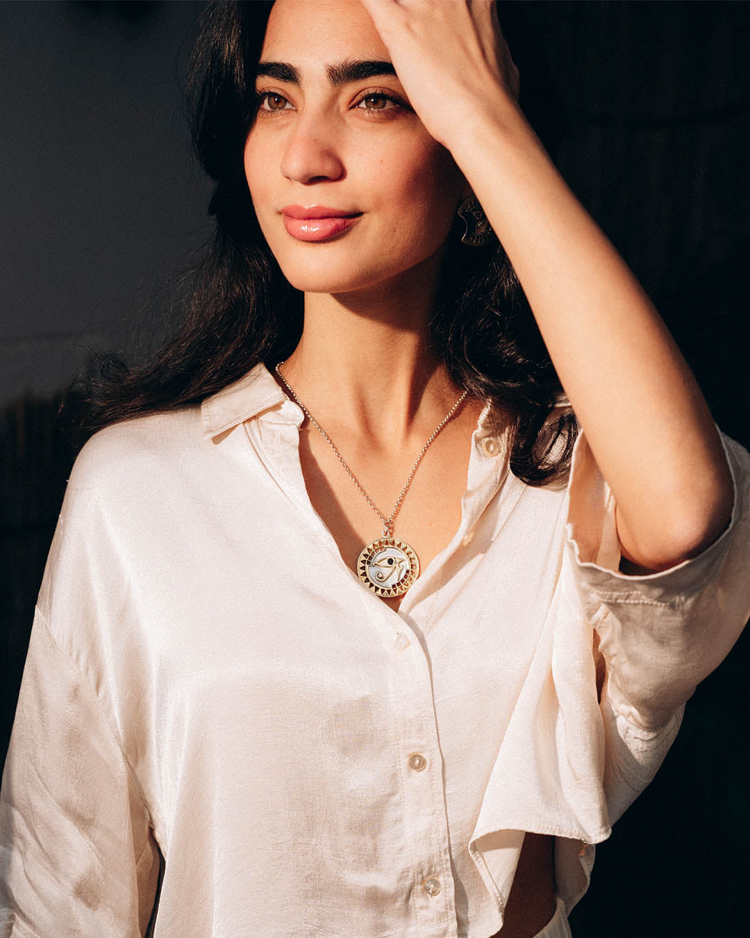 Sterling silver Eye of Horus necklace with protective symbolism and textured geometric accents.