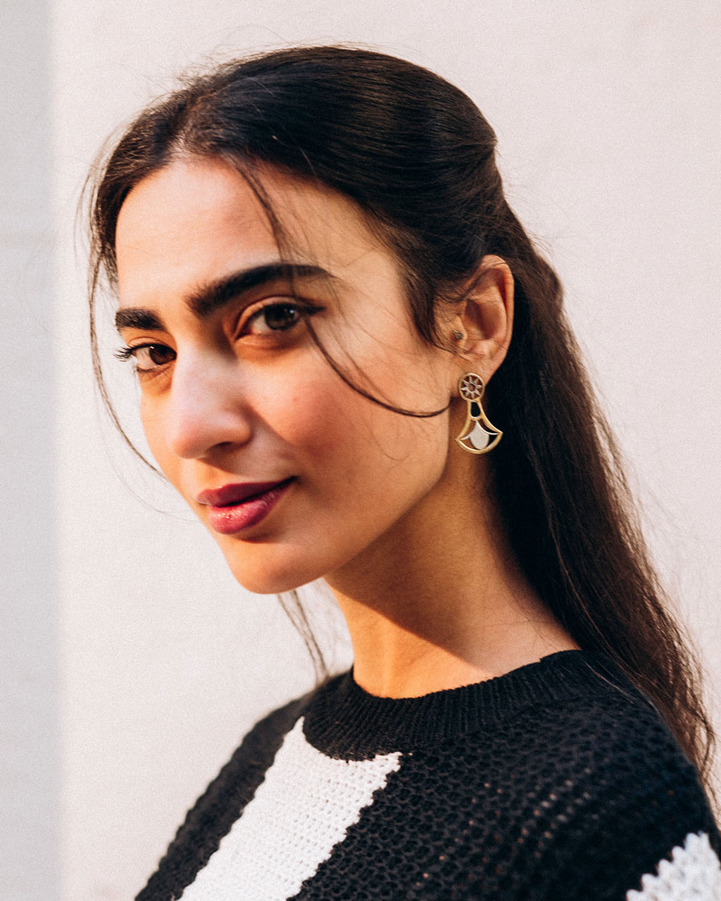 18k gold plated lotus flower earrings with a sterling silver base and intricate open-work design