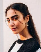 18k gold plated lotus flower earrings with a sterling silver base and intricate open-work design