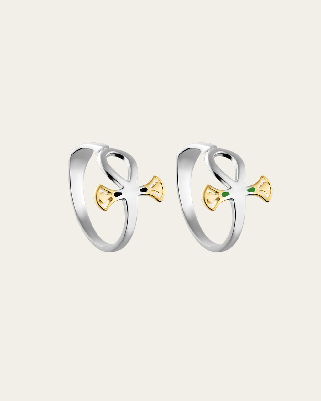 Pair of sterling silver rings with 18k gold plated accents, inspired by the ankh symbol