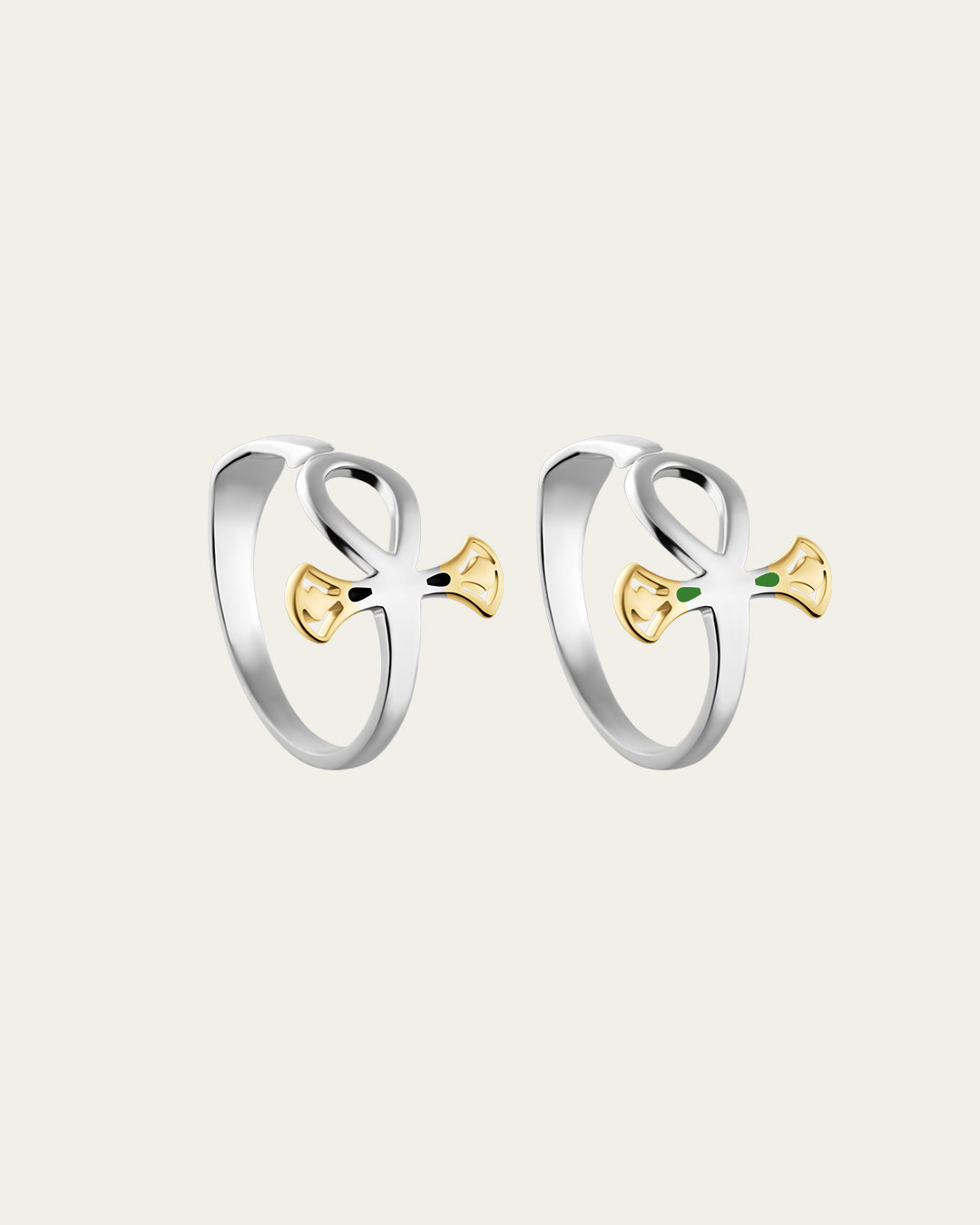 Pair of sterling silver rings with 18k gold plated accents, inspired by the ankh symbol