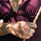 Statement sterling silver and 18k gold plated Ancient Sun ring featuring a textured sunburst face and an adjustable band.