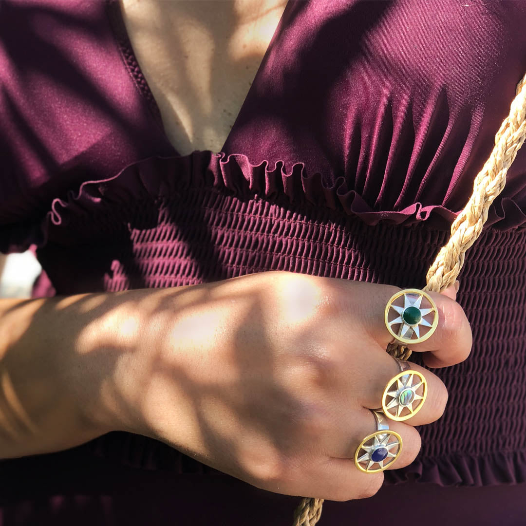 Statement sterling silver and 18k gold plated Ancient Sun ring featuring a textured sunburst face and an adjustable band.