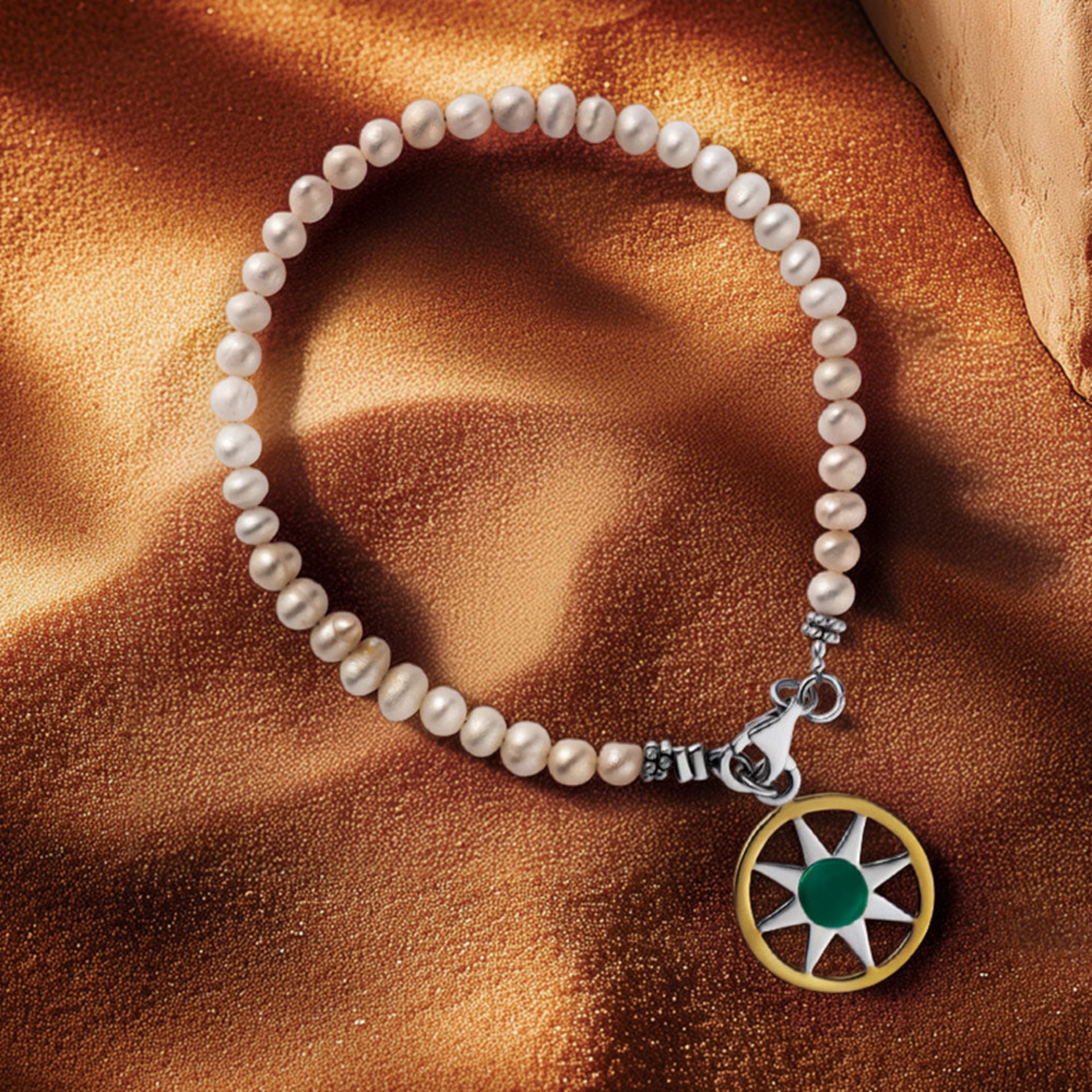 sterling silver and 18k Gold Ancient Sun link bracelet with multiple sunburst charms and a secure lobster clasp, white pearl beads