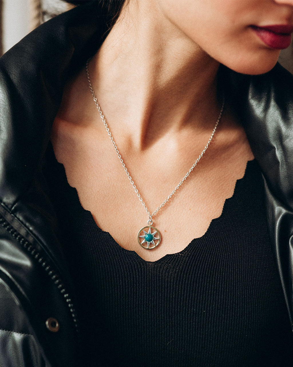 Ancient Sun pendant necklace in sterling silver and 18k gold plating with a sunburst motif and a delicate adjustable chain.