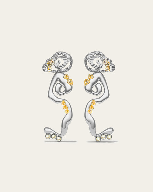 Statement Cascade drop earrings in 18k gold plated metal with a fluid, liquid-gold waterfall silhouette