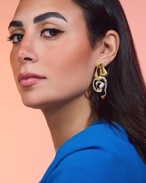 Clyra gold plated earrings featuring an elegant curved design with a high-polish finish and organic texture.