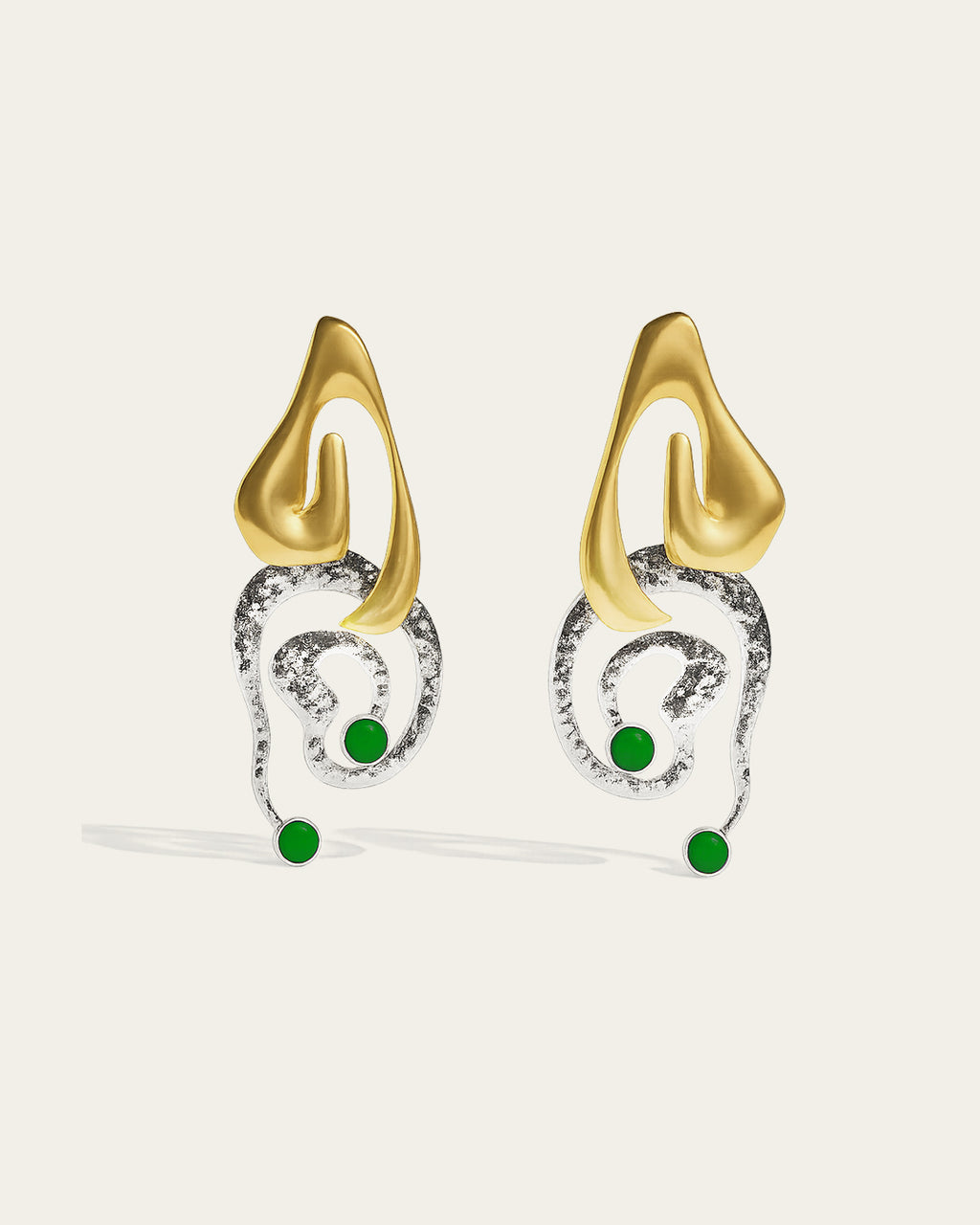 Clyra gold plated earrings featuring an elegant curved design with a high-polish finish and organic texture.