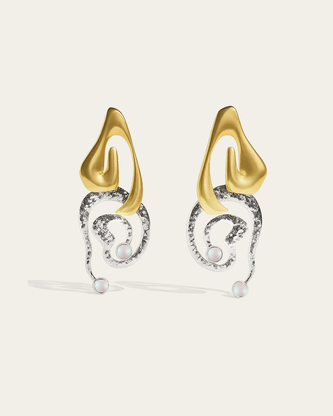 Clyra gold plated earrings featuring an elegant curved design with a high-polish finish and organic texture.