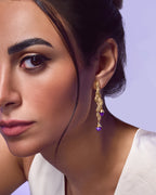 Handcrafted Fluva earrings in 18k gold plated silver with a bold, sculptural shape inspired by flowing water.