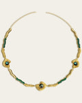Glema necklace featuring earth-toned green resin and a central textured gold charm with a paua seahell