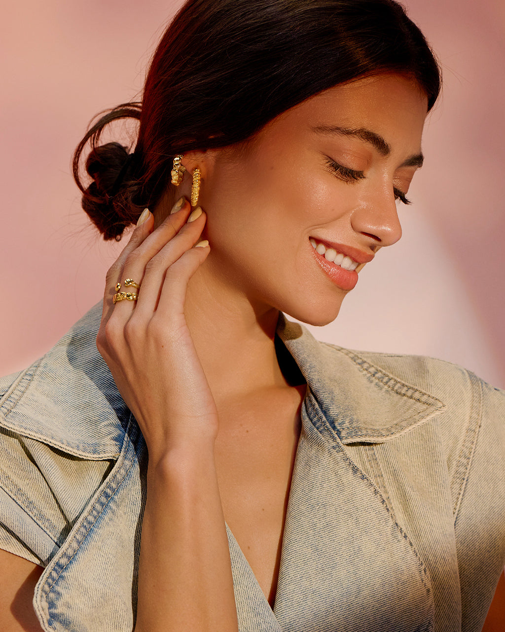 Model wearing Madar and Nile hoops stack, gold-plated hoop earrings styled together for an everyday elegant look by Ann Elsaban Jewelry.