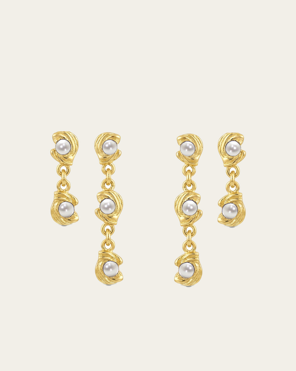 Mini Glema earrings stack in 18K gold-plated brass with all in white seashell stones, shown as a coordinated drop-earring bundle with built-in 15% discount.