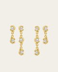 Mini Glema earrings stack in 18K gold-plated brass with all in white seashell stones, shown as a coordinated drop-earring bundle with built-in 15% discount.