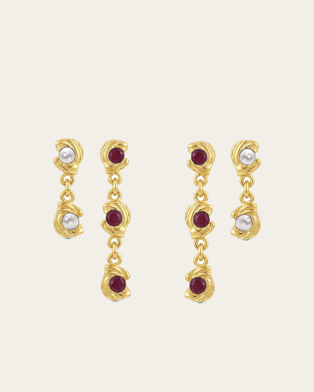 Mini Glema earrings stack in 18K gold-plated brass with red stones and white seashell details, shown as a coordinated drop-earring bundle with built-in 15% discount.