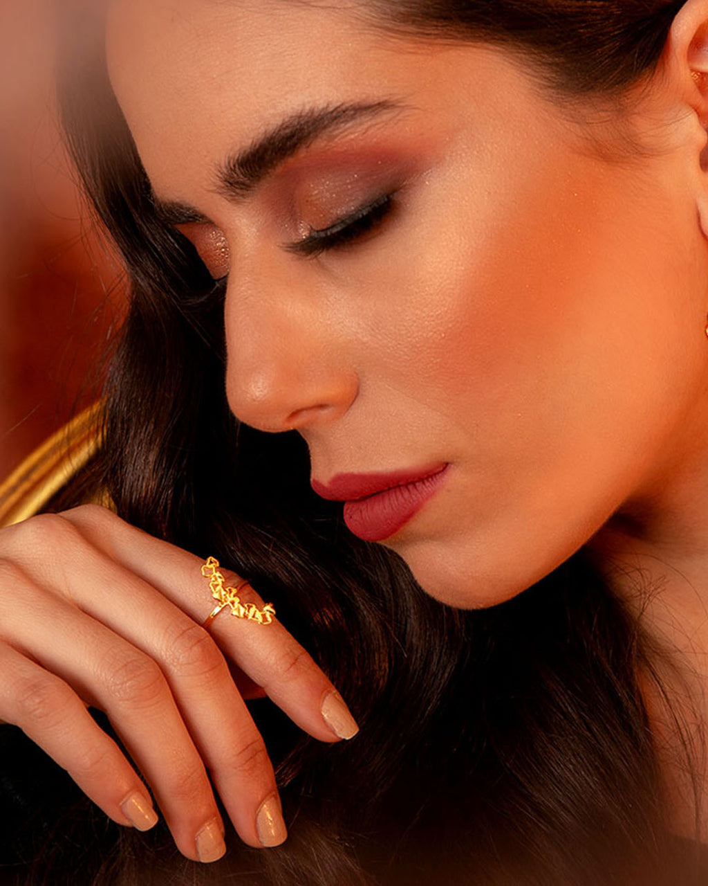 Handcrafted Ripple gold ring with an organic, wavy silhouette featuring small abstract geometric cutouts