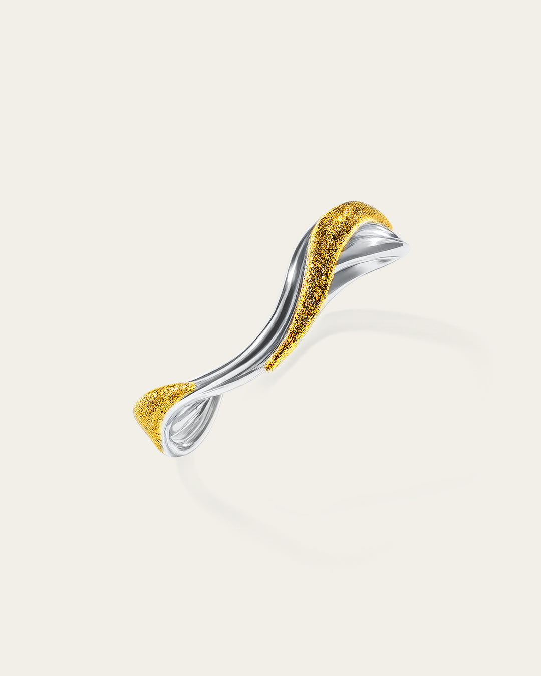Rivera bangle featuring a twisted mixed-metal design with rhodium plated and 18k gold plated strands, Two-tone Rivera statement bangle in 18k gold plated and rhodium silver with a handcrafted textured finish.