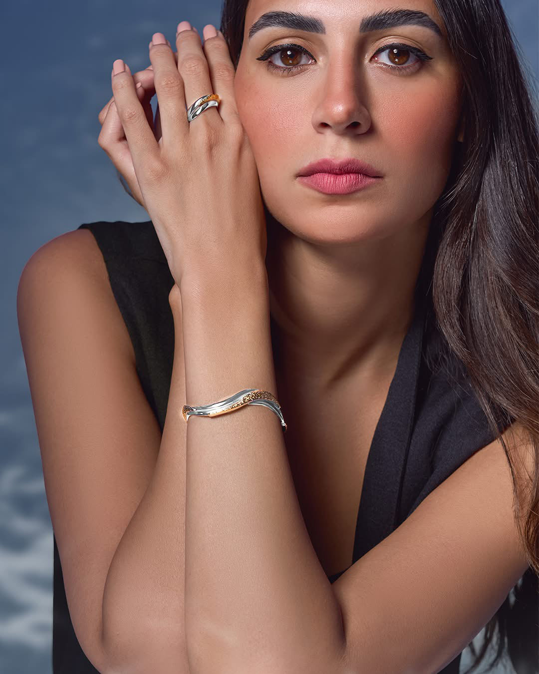 Rivera bangle and ring set in 18k gold-plated brass featuring smooth, sculptural organic forms.