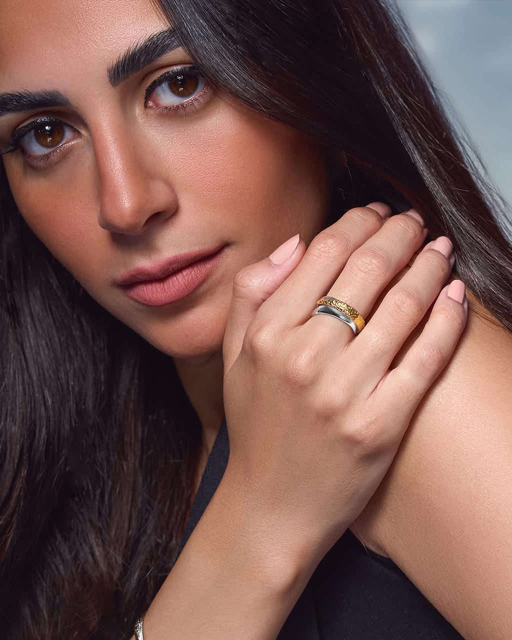 Rivera ring in 18k gold plated and rhodium finishes with a unique open-work sculptural wave design, Mixed-metal Rivera ring with rhodium and 18k gold plating, a modern geometric band for stacking