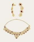 Gold Sheftesh filigree necklace and earring set with red stone details in a geometric honeycomb pattern