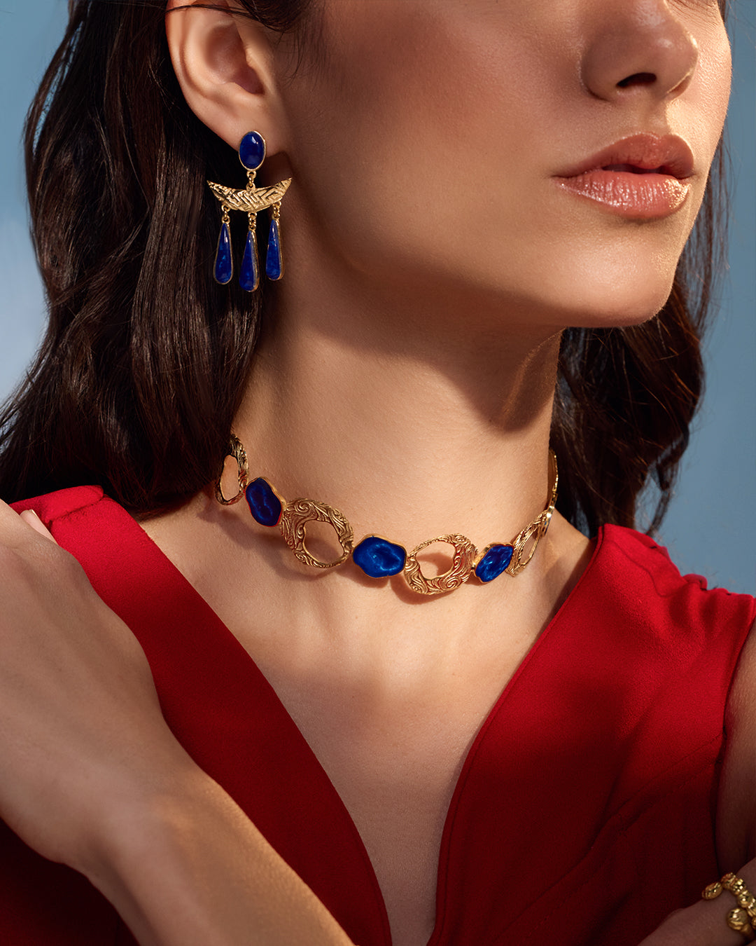 Gold Teif jewelry set with emerald green enamel choker, textured open cuff, and malachite-style drop earrings