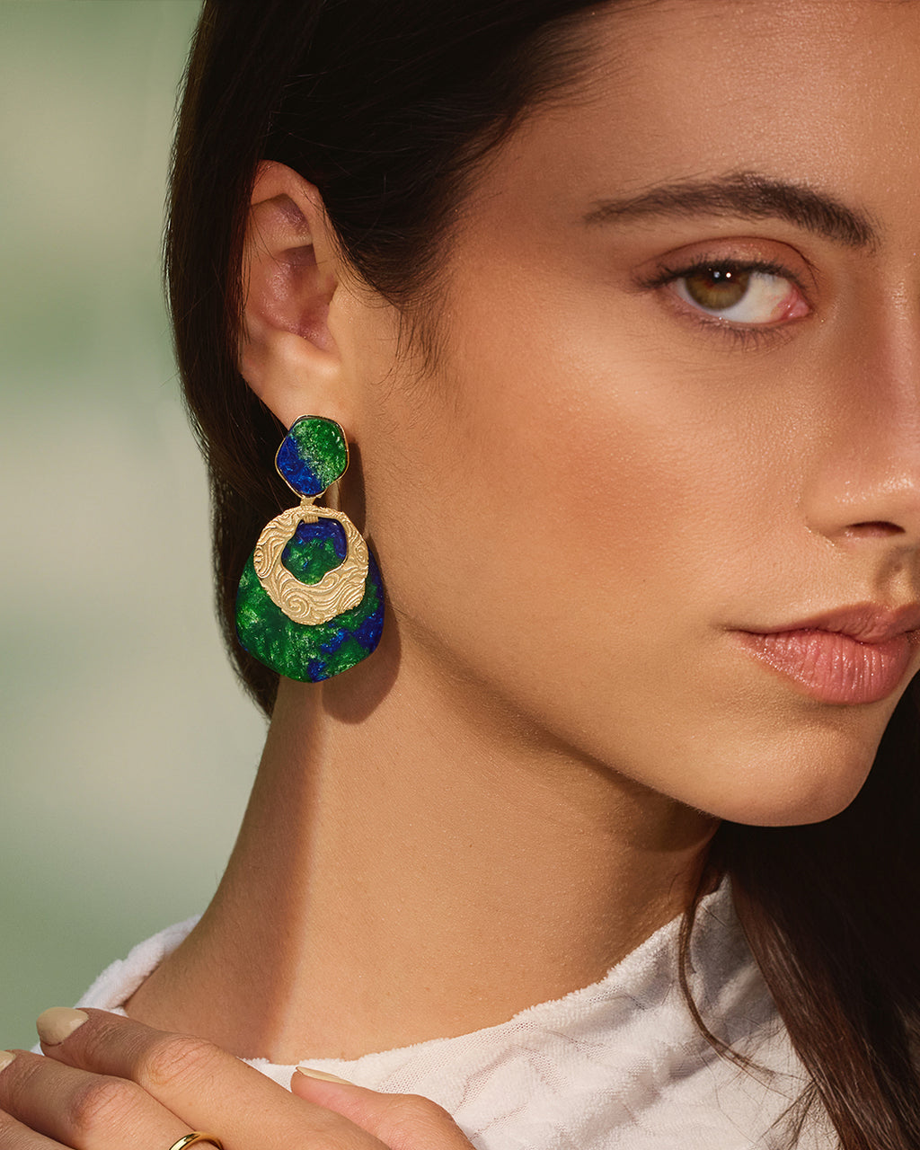 Gold Teif jewelry set with emerald green enamel choker, textured open cuff, and malachite-style drop earrings