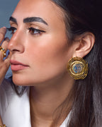 Whirl 18k gold plated earrings featuring dynamic spiral designs and a textured gold finish